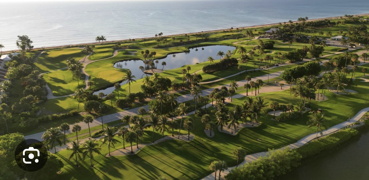 Championship golf course in Palm Beach with palm trees and Atlantic Ocean view