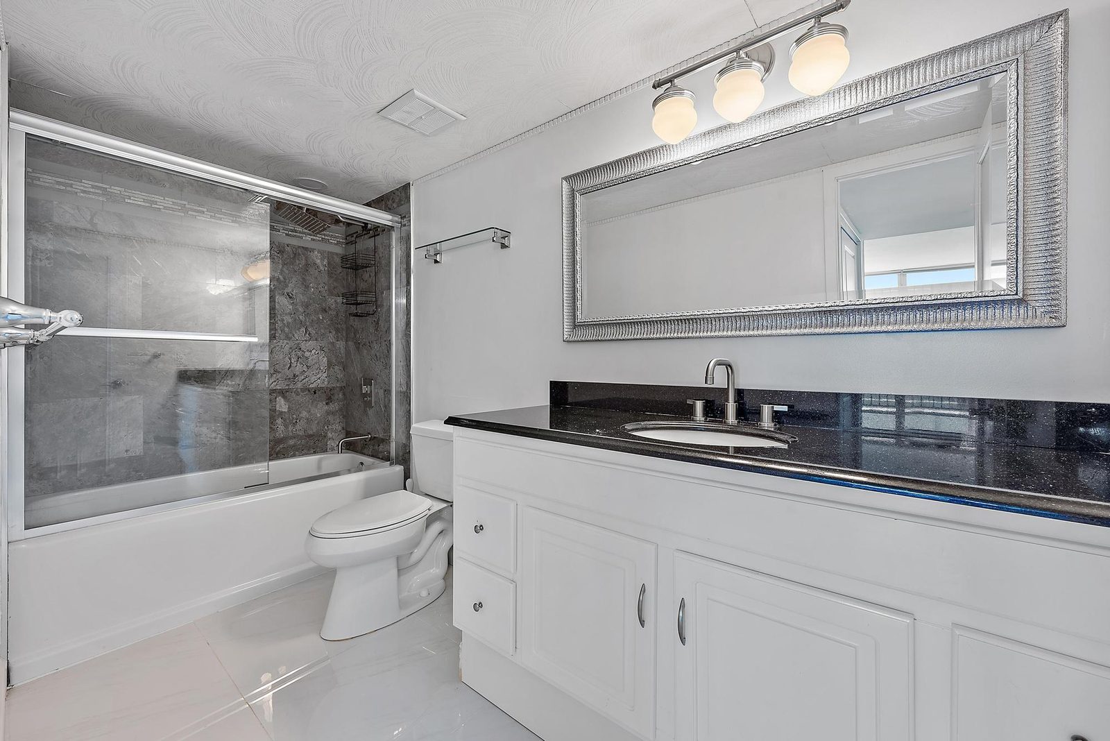 Second bathroom with combination tub and shower